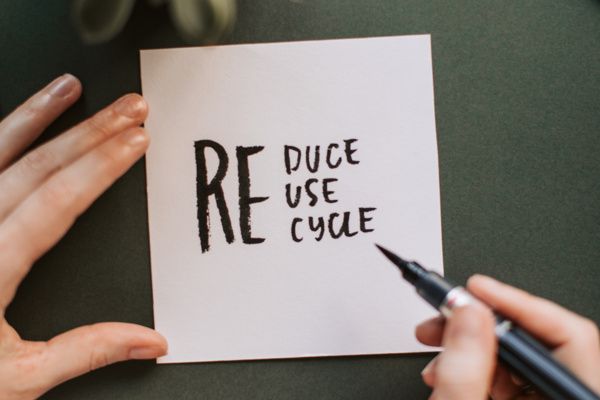 Card with the words "Reduce", "Reuse" and "Recycle"