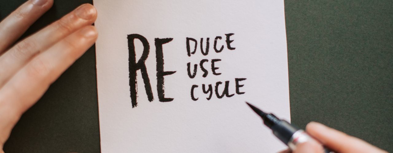 Card with the words "Reduce", "Reuse" and "Recycle"